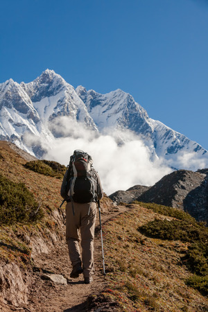 Hiker walks on train in Himalayasの写真素材
