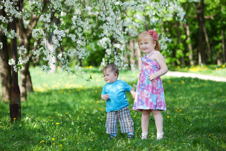 boy and girl plays in parkの写真素材