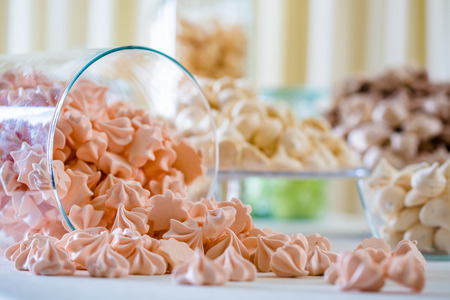 Colorful meringue closeup at white table の写真素材