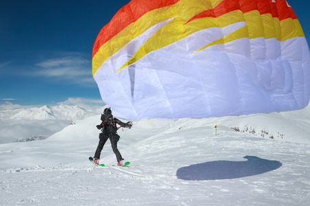 Paraglider in winter mountains of Georgia