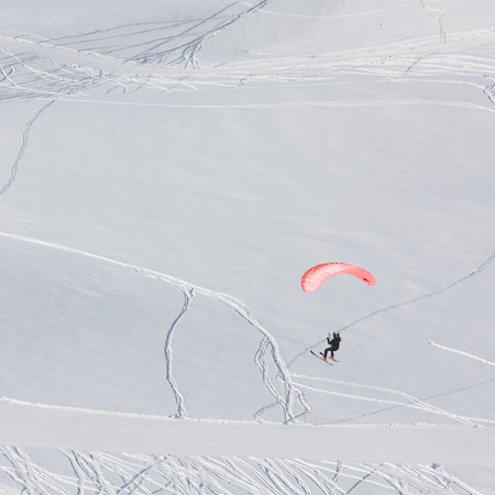 Paraglider in winter mountains of Georgiaの写真素材