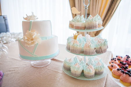 cupcakes at white table in high light style.の写真素材