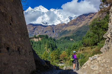 Biker-girl in Himalaya mountains, Anapurna regionの写真素材