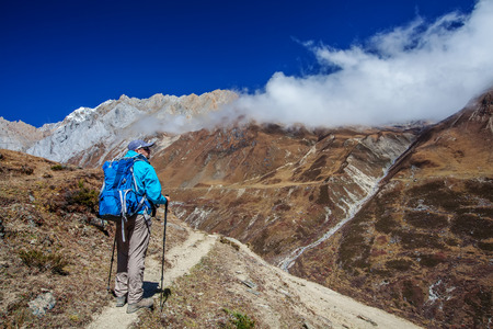 Hiker on the trek in Himalayas, Manaslu region, Nepalの写真素材