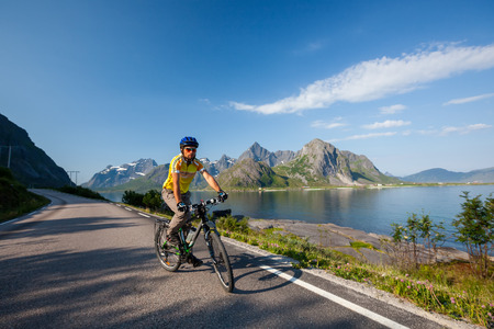 Biking in Norway against picturesque landscapeの写真素材