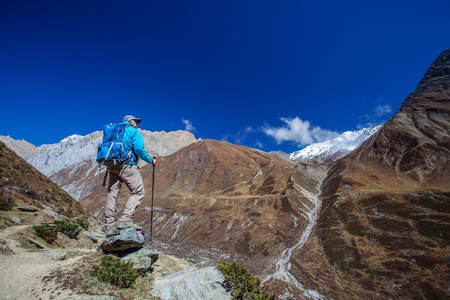 Hiker on the trek in Himalayas, Manaslu region, Nepalの写真素材