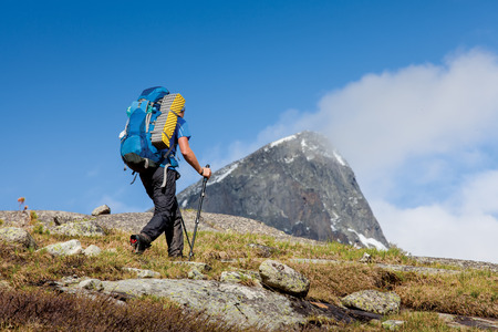 Young woman is hiking in highlands of Altai mountains, Russiaの写真素材