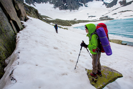 Young woman is hiking in highlands of Altai mountains, Russiaの写真素材