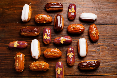 Eclairs on wooden table