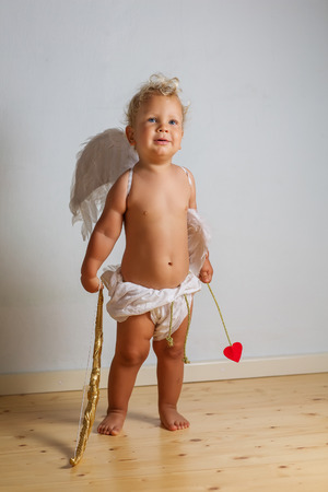 Small cupid is posing to the cameraの写真素材