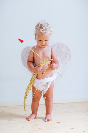 Small cupid is posing to the cameraの写真素材