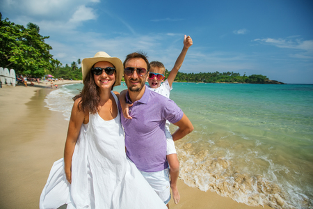Family on vacation at the seashore of Indian oceanの写真素材