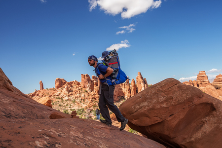 A family with baby son visits Arches National Park in Utah, USAの写真素材
