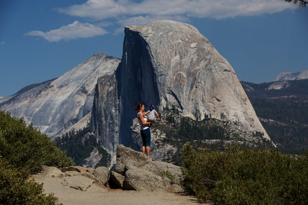 Mother with infant son visit Yosemite national park in Californiaの写真素材