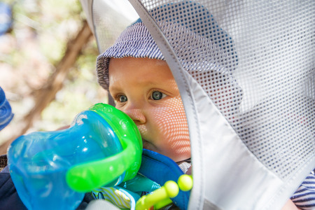 A man with his baby boy are trekking in Zion national park, Utah, USA