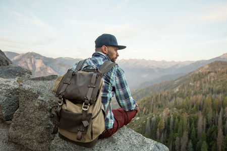 Hiker meets the sunset on the Moro rock in Sequoia national park, California, USA.の写真素材
