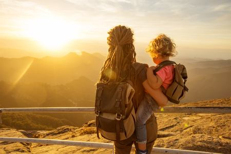 Family meets the sunset on the Moro rock in Sequoia national park, California, USA.の写真素材