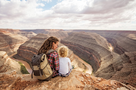 Mother with son relax in Goosenecks state Park,  USAの写真素材