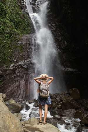 Woman near waterfal on Bali, IndonesiaÂ の写真素材