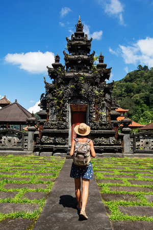 Woman tourist in a temple on the island of Baliの写真素材