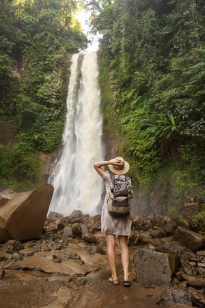  Woman near waterfal Git Git on Bali, IndonesiaÂ の写真素材