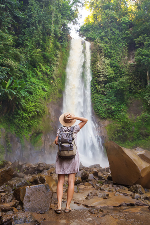  Woman near waterfal Git Git on Bali, IndonesiaÂ の写真素材