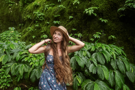 Woman near waterfal on Bali, IndonesiaÂ の写真素材