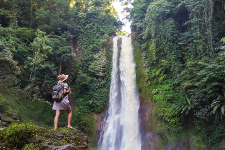 Woman near waterfal Git Git on Bali, IndonesiaÂ の写真素材