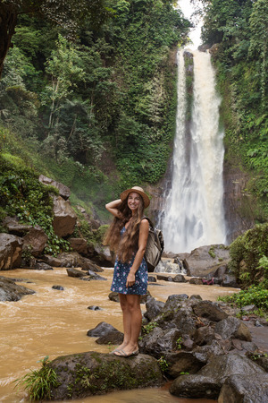 Woman near waterfal Git Git on Bali, IndonesiaÂ の写真素材