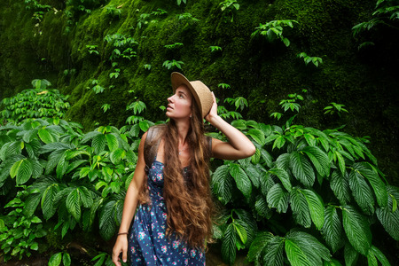 Woman near waterfal on Bali, IndonesiaÂ の写真素材