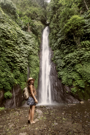 Woman near Munduk waterfal on Bali, Indonesiaの写真素材