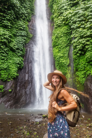 Woman near Munduk waterfal on Bali, Indonesiaの写真素材