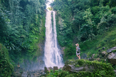 Woman near waterfal Git Git on Bali, IndonesiaÂ の写真素材