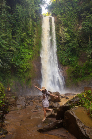 Woman near waterfal Git Git on Bali, IndonesiaÂ の写真素材