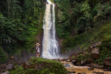 Woman near waterfal Git Git on Bali, IndonesiaÂ の写真素材