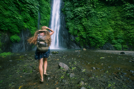Woman near Munduk waterfal on Bali, Indonesiaの写真素材