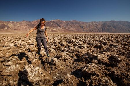 A hiker in Death Valley National Park, Geology, sand.の写真素材