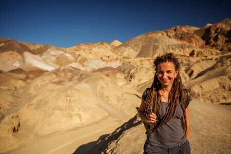 A hiker in the Artist`s Palette landmark place in Death Valley National Park, Geology, sand.の写真素材