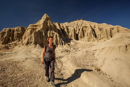 A hiker in the Artist`s Palette landmark place in Death Valley National Park, Geology, sand.の写真素材