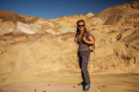 A hiker in the Artist`s Palette landmark place in Death Valley National Park, Geology, sand.の写真素材
