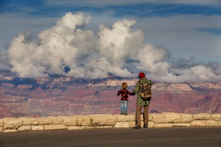 A man with his son are hiking in Grand canyon National Parkの写真素材