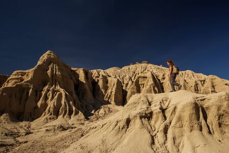 A hiker in the Artist`s Palette landmark place in Death Valley National Park, Geology, sand.の写真素材