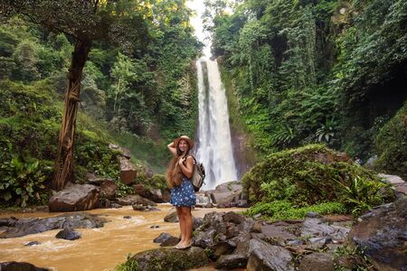 Woman near waterfal Git Git on Bali, IndonesiaÂ の写真素材