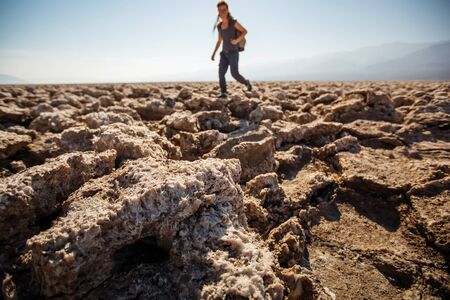 A hiker in Death Valley National Park, Geology, sand.の写真素材