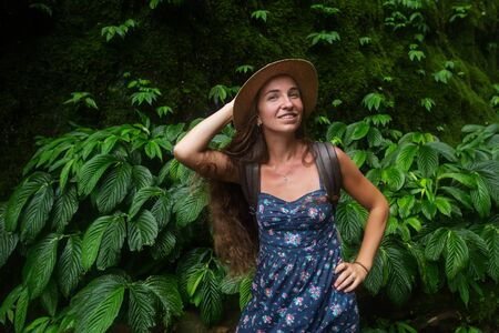 Woman near waterfal on Bali, IndonesiaÂ の写真素材