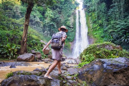 Woman near waterfal Git Git on Bali, IndonesiaÂ の写真素材