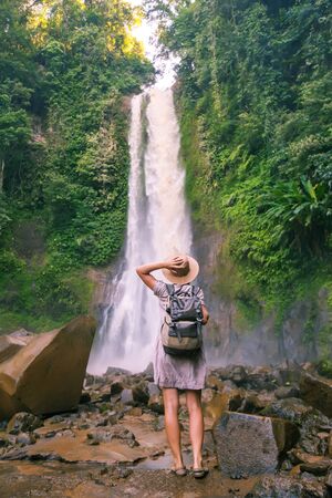 Woman near waterfal Git Git on Bali, IndonesiaÂ の写真素材