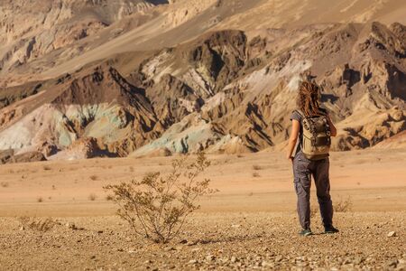 A hiker in the Artist`s Palette landmark place in Death Valley National Park, Geology, sand.の写真素材