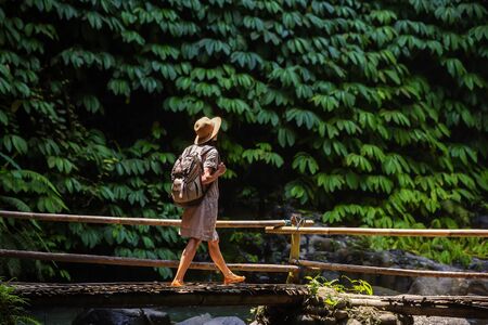 Woman near Nung Nung waterfal on Bali, Indonesiaの写真素材