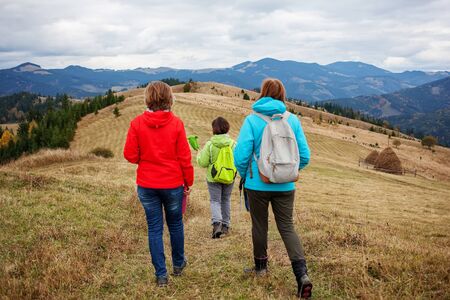 Hiker woman in moumtains in autumnの写真素材